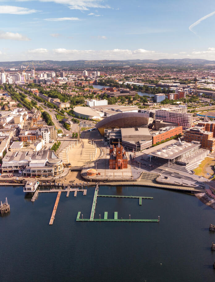 Aerial view of Cardiff Bay, its waters and surrounding buildings.