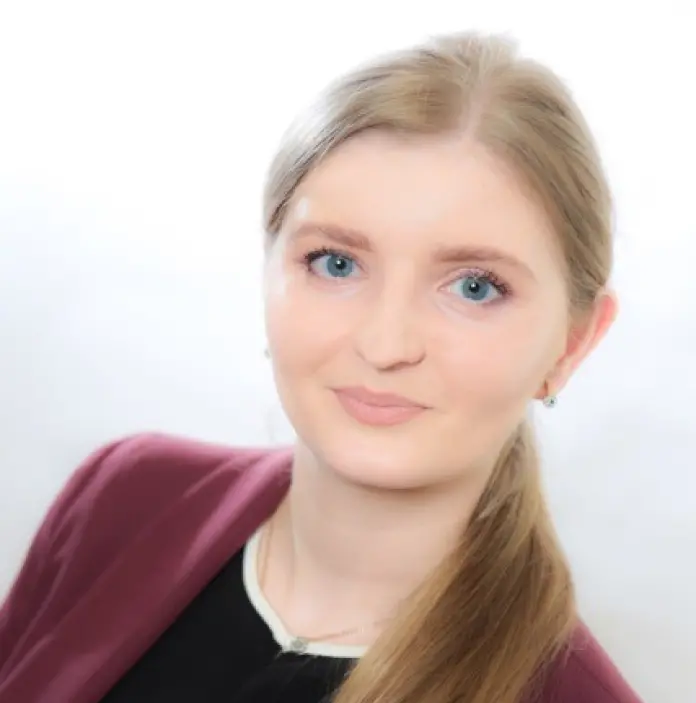 Bio image of Nataliia Luhyna in burgundy blazer