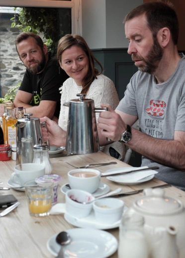 Group of people sat at a dining table.
