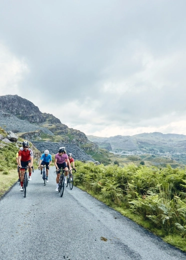group of people cycling in Wales