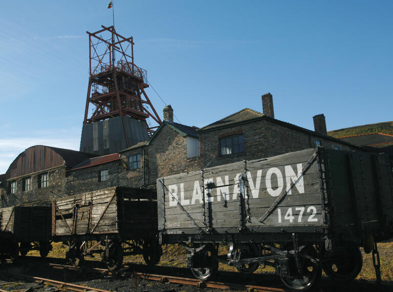 Wagons and the pit head tower at a mining attraction.