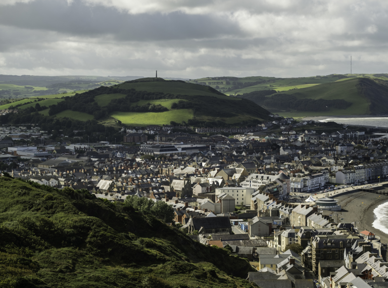 View of a seaside town from a hill.
