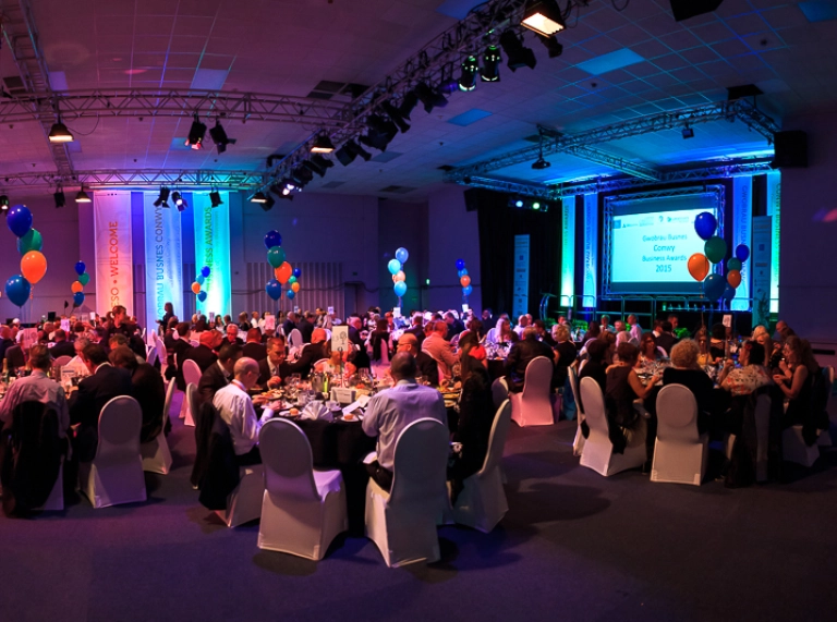 People sat down at tables at an awards evening.