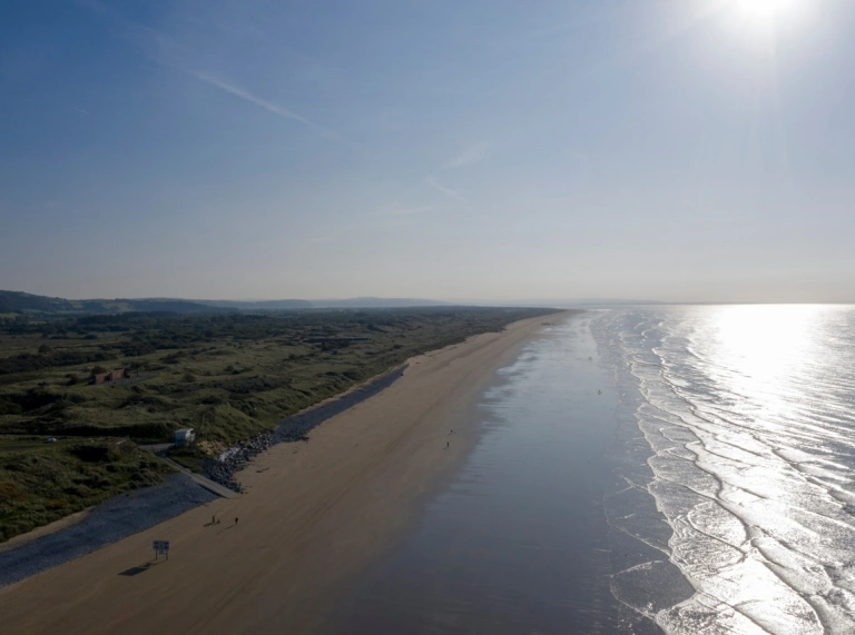 Pendine Sands beach and background mountains