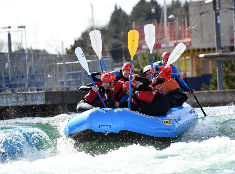 Adut group in raft on the water rapids