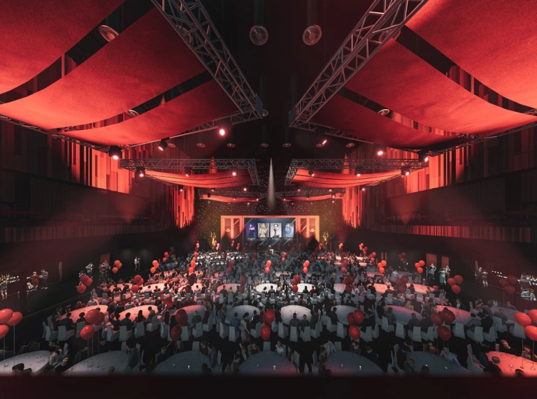 Interior of Swansea Arena set up for a banquet wth red ceiling drapes and tables laid out