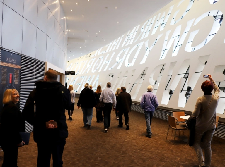 people walking around the WMC looking a the inscription wall