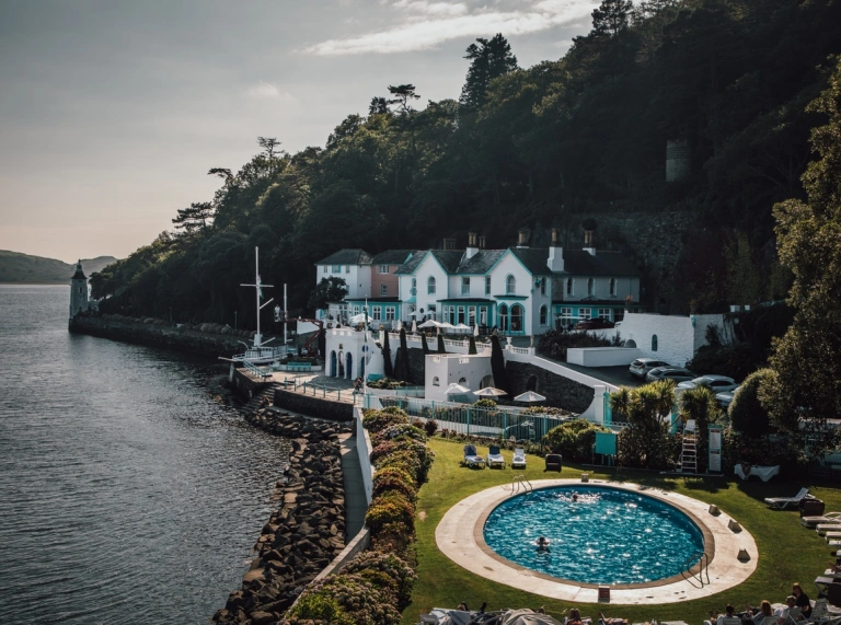 Portmeirion Hotel with pool and gardens sitting alongside the estuary