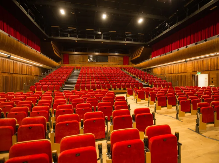 Swansea University Bay Campus theatre with staged red chairs