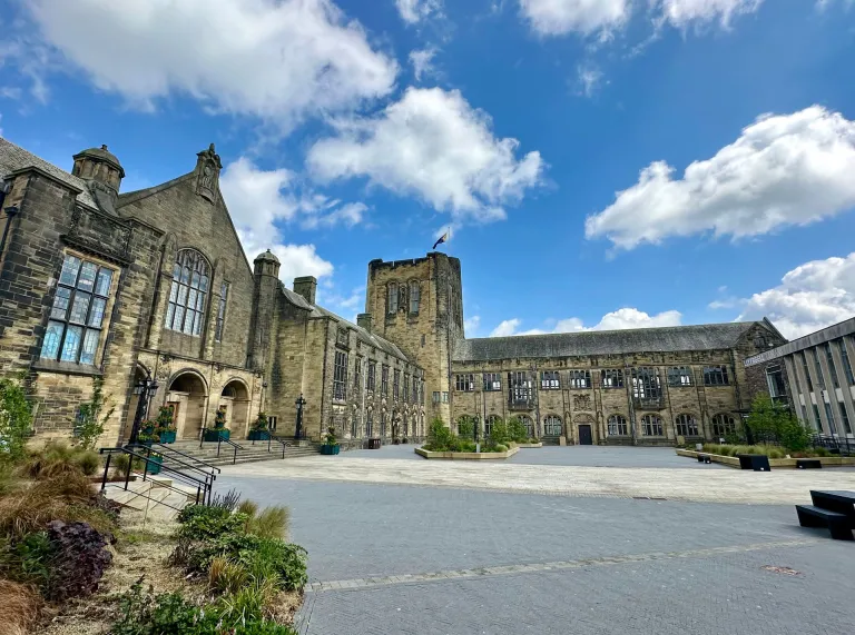Bangor University forecourt with clouds and blue sky 