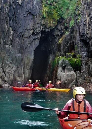 Group in kayaks in caves.