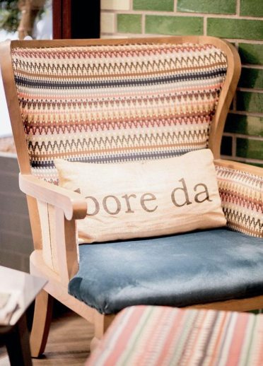 Chair with a cushion on saying bore da.