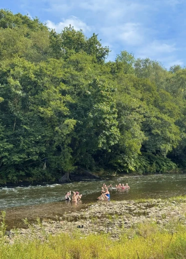 Group of people enjoying a wild swim