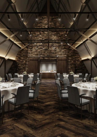 A conference room set up with round tables in the roof of a large hotel.