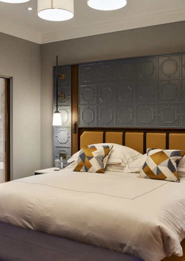 A bedroom and ensuite bathroom at a hotel.