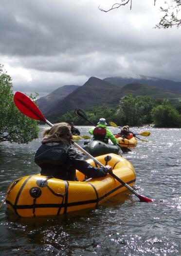 People pack rafting with Adventure Tours UK.