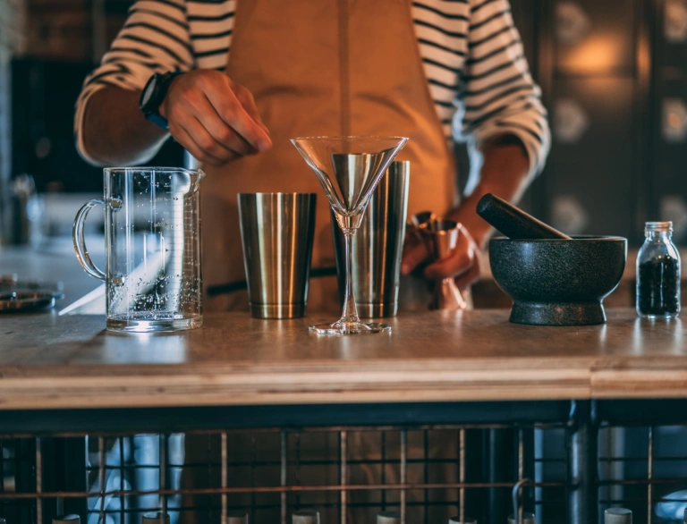 A bartender making a cocktail.
