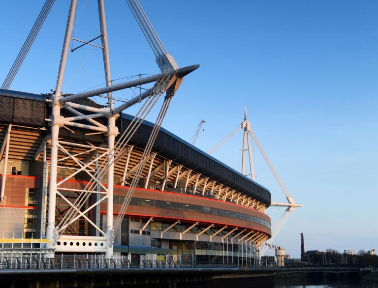 A side view of Principality Stadium sitting alongside the river.