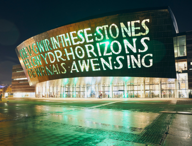 Exterior of Wales Millennium Centre at night.