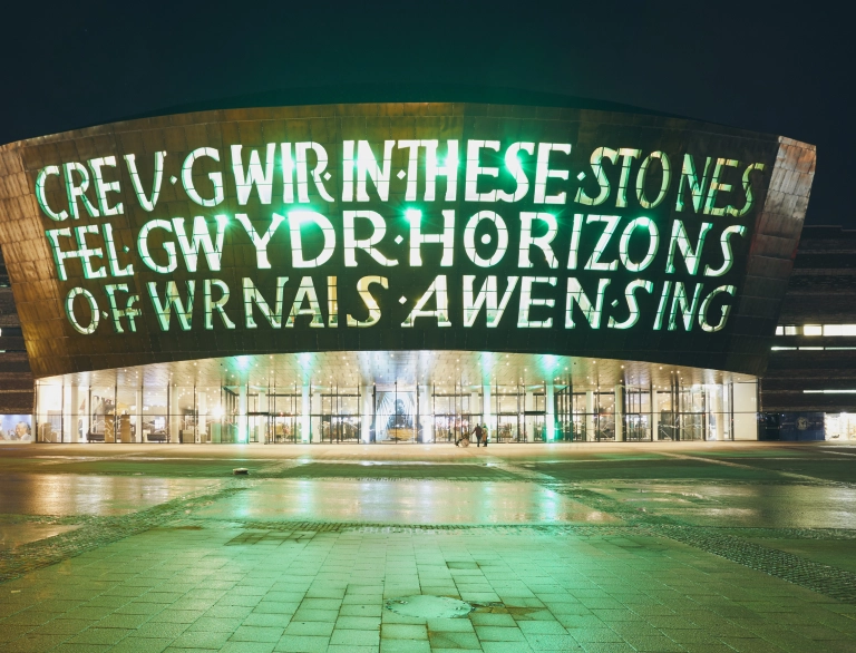 Exterior of the Wales Millennium Centre at night.