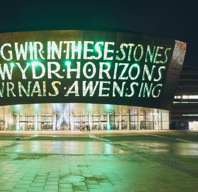 Exterior of the Wales Millennium Centre at night.