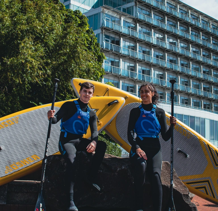 Paddle Boarders outside voco® St David's.
