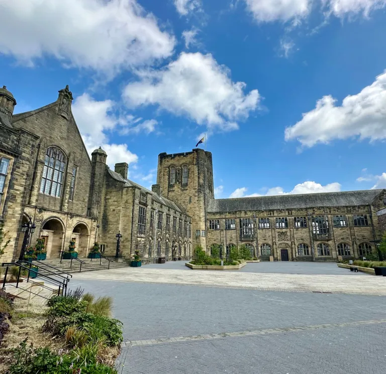 Bangor University forecourt with clouds and blue sky 