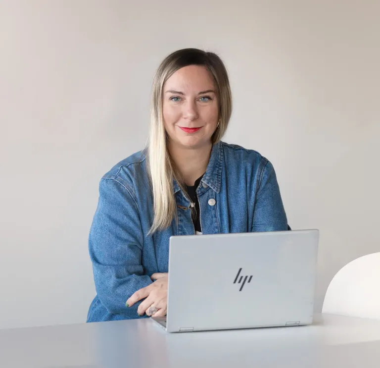 bio image of Sofia Christidi sitting at her laptop working