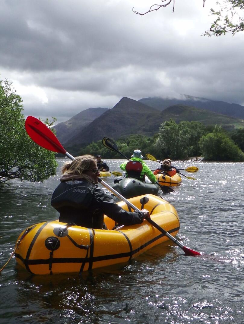 People pack rafting with Adventure Tours UK.