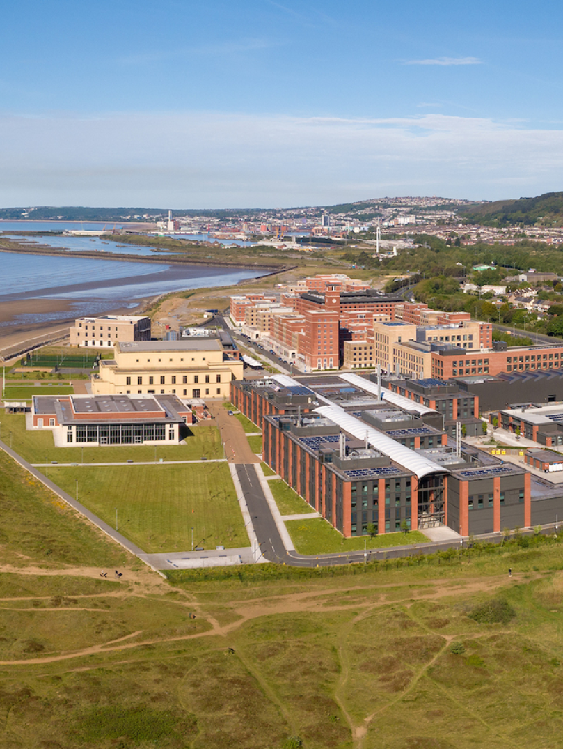 Aerial shot of a university with views across the bay.