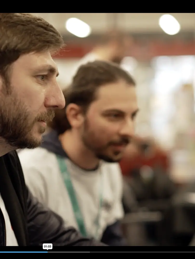John Jackson and colleague intently looking at a computer screen