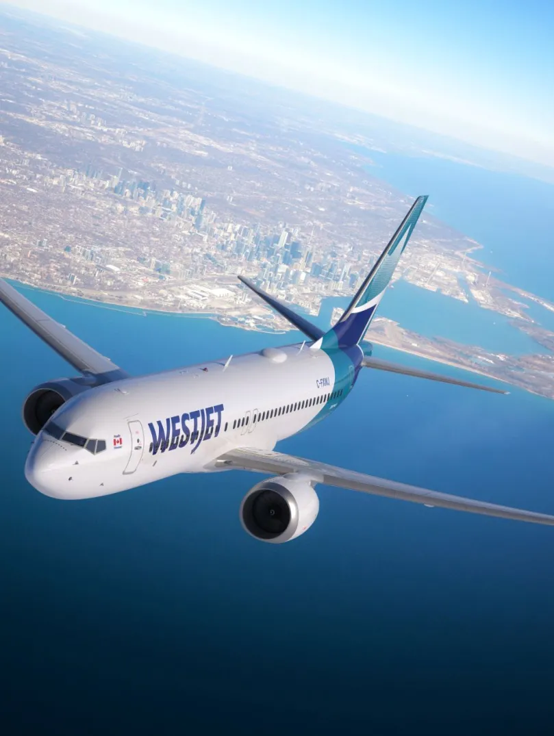 An aircraft in the sky above the sea