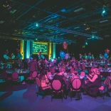 People enjoying a gala dinner evening inside the Venue Cymru.