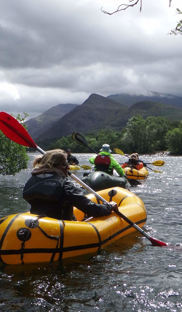 People pack rafting with Adventure Tours UK.